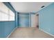 Light-blue bedroom with a built-in closet and neutral carpet at 2054 Envoy Ct, Clearwater, FL 33764