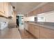 View of kitchen with white cabinets and dark countertops at 2054 Envoy Ct, Clearwater, FL 33764