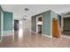 Living room with tiled floors and sliding doors to patio at 2054 Envoy Ct, Clearwater, FL 33764