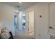 Upstairs hallway with carpet and doors leading to bedrooms or bathrooms at 2075 Hallier Cv, Wesley Chapel, FL 33543