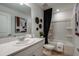 Bathroom featuring a shower-tub combo, framed art, and white vanity at 2101 Hallier Cv, Wesley Chapel, FL 33543