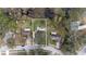 Aerial view of a home highlighting its lot size and location within a treed neighborhood at 24121 Landing Dr, Lutz, FL 33559