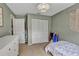 Bedroom with ample closet space, natural light, and a tranquil, comfortable setting at 24121 Landing Dr, Lutz, FL 33559