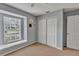 Bedroom with a window bench and neutral color scheme, offering a serene and inviting atmosphere at 24121 Landing Dr, Lutz, FL 33559