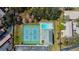 A bird's-eye view highlights the community pool, clubhouse, and tennis courts, perfect for recreation at 2559 Stony Brook Ln, Clearwater, FL 33761