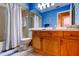 Bright bathroom featuring a tub with shower and updated vanity with wood cabinets at 2559 Stony Brook Ln, Clearwater, FL 33761