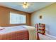 Bedroom featuring a ceiling fan and window providing natural light at 2559 Stony Brook Ln, Clearwater, FL 33761