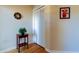 Clean entryway showcasing a mirrored wall decoration, a table with a plant, and a closet at 2559 Stony Brook Ln, Clearwater, FL 33761