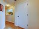 Entryway featuring hardwood floors and a peek into the adjacent kitchen at 2559 Stony Brook Ln, Clearwater, FL 33761