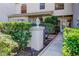 Inviting front entrance features lush landscaping at 2559 Stony Brook Ln, Clearwater, FL 33761