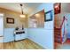 Hallway showing a stairway and view into a room with a snack bar at 2559 Stony Brook Ln, Clearwater, FL 33761