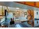 Kitchen with granite counters featuring a view of stairway and front door at 2559 Stony Brook Ln, Clearwater, FL 33761