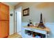 View of the kitchen's bar and decorative items on white shelves near an open doorway at 2559 Stony Brook Ln, Clearwater, FL 33761