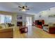 The living room features a fireplace, ceiling fan, sliding doors, and a television at 2559 Stony Brook Ln, Clearwater, FL 33761