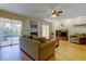 Relaxing living room with fireplace, sliding glass doors to a patio, and comfortable seating at 2559 Stony Brook Ln, Clearwater, FL 33761