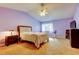 Spacious main bedroom featuring a ceiling fan and large window at 2559 Stony Brook Ln, Clearwater, FL 33761