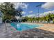 Community pool featuring paved surfaces, providing a refreshing amenity for residents and their guests at 2559 Stony Brook Ln, Clearwater, FL 33761