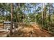 This beautiful backyard features a chicken coop, making it the perfect space for homesteading enthusiasts at 26890 Hiawatha Blvd, Brooksville, FL 34601