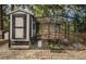 Charming chicken coop with secure run offers a delightful feature for those seeking a sustainable lifestyle at 26890 Hiawatha Blvd, Brooksville, FL 34601