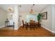 Well-lit dining area featuring hardwood floors and a view of the front yard at 26890 Hiawatha Blvd, Brooksville, FL 34601