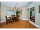 Cozy dining room with hardwood floors, natural light, and stylish light fixture at 26890 Hiawatha Blvd, Brooksville, FL 34601