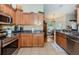 Kitchen featuring stainless steel appliances, granite counters, and breakfast bar into the dining area at 26890 Hiawatha Blvd, Brooksville, FL 34601