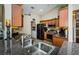 Modern kitchen featuring tile floors, stainless steel sink, and black appliances at 26890 Hiawatha Blvd, Brooksville, FL 34601