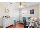 Bright bedroom with hardwood floors, a ceiling fan, and a comfortable daybed next to a stylish white dresser at 2819 47Th S Ave, St Petersburg, FL 33712