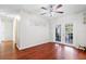 Open dining area featuring wood floors and an outdoor view through glass doors at 2819 47Th S Ave, St Petersburg, FL 33712