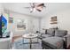 Inviting living room showcasing a gray sectional and bright natural light at 2819 47Th S Ave, St Petersburg, FL 33712