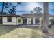 Home exterior and backyard view showcasing sliding glass doors at 3241 Rogue St, North Port, FL 34291