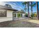 Home exterior showcasing sliding glass doors opening to the backyard at 3241 Rogue St, North Port, FL 34291