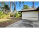 Large backyard with a patio and mature trees at 3241 Rogue St, North Port, FL 34291