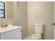 Clean bathroom with white vanity and toilet at 3241 Rogue St, North Port, FL 34291