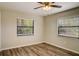 Bedroom with two windows and vinyl flooring at 3241 Rogue St, North Port, FL 34291