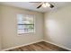 Simple bedroom with vinyl flooring and window at 3241 Rogue St, North Port, FL 34291