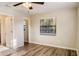 Bedroom with vinyl flooring, window and access to bathroom at 3241 Rogue St, North Port, FL 34291