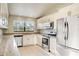 Spacious kitchen featuring granite countertops and stainless steel appliances at 3241 Rogue St, North Port, FL 34291