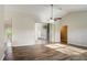 Living room with vinyl plank flooring and sliding doors leading to a patio at 3241 Rogue St, North Port, FL 34291