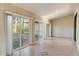 Sunroom with tiled floor and sliding glass doors at 3241 Rogue St, North Port, FL 34291