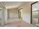 Sunroom with tile floors and sliding glass doors to backyard at 3241 Rogue St, North Port, FL 34291