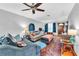 Bright living room with hardwood floors, ceiling fan, and neutral paint at 3512 Haines N Rd, St Petersburg, FL 33704