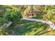 Overhead view of a spacious backyard featuring lush lawn and full privacy fence at 415 5Th N St, Safety Harbor, FL 34695