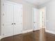 This bedroom features a double closet and an open doorway at 415 5Th N St, Safety Harbor, FL 34695