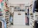 Walk-in closet with custom shelving and drawers for maximum storage and organization at 415 5Th N St, Safety Harbor, FL 34695