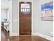 Welcoming entryway with a solid wood door and views of a home office at 415 5Th N St, Safety Harbor, FL 34695