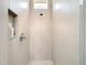 The bathroom shower features modern tile, a built-in niche, and contemporary fixtures at 415 5Th N St, Safety Harbor, FL 34695