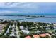 Scenic aerial view showcasing waterfront condos, serene bay, and harbor at 4212 126Th W St # 401, Cortez, FL 34215
