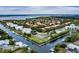 Gorgeous aerial shot of waterfront condos, boat docks, tennis courts, and waterways at 4212 126Th W St # 401, Cortez, FL 34215