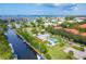 Aerial view showcasing a home with a private pool, boat dock, and stunning waterfront community at 4212 126Th W St # 401, Cortez, FL 34215